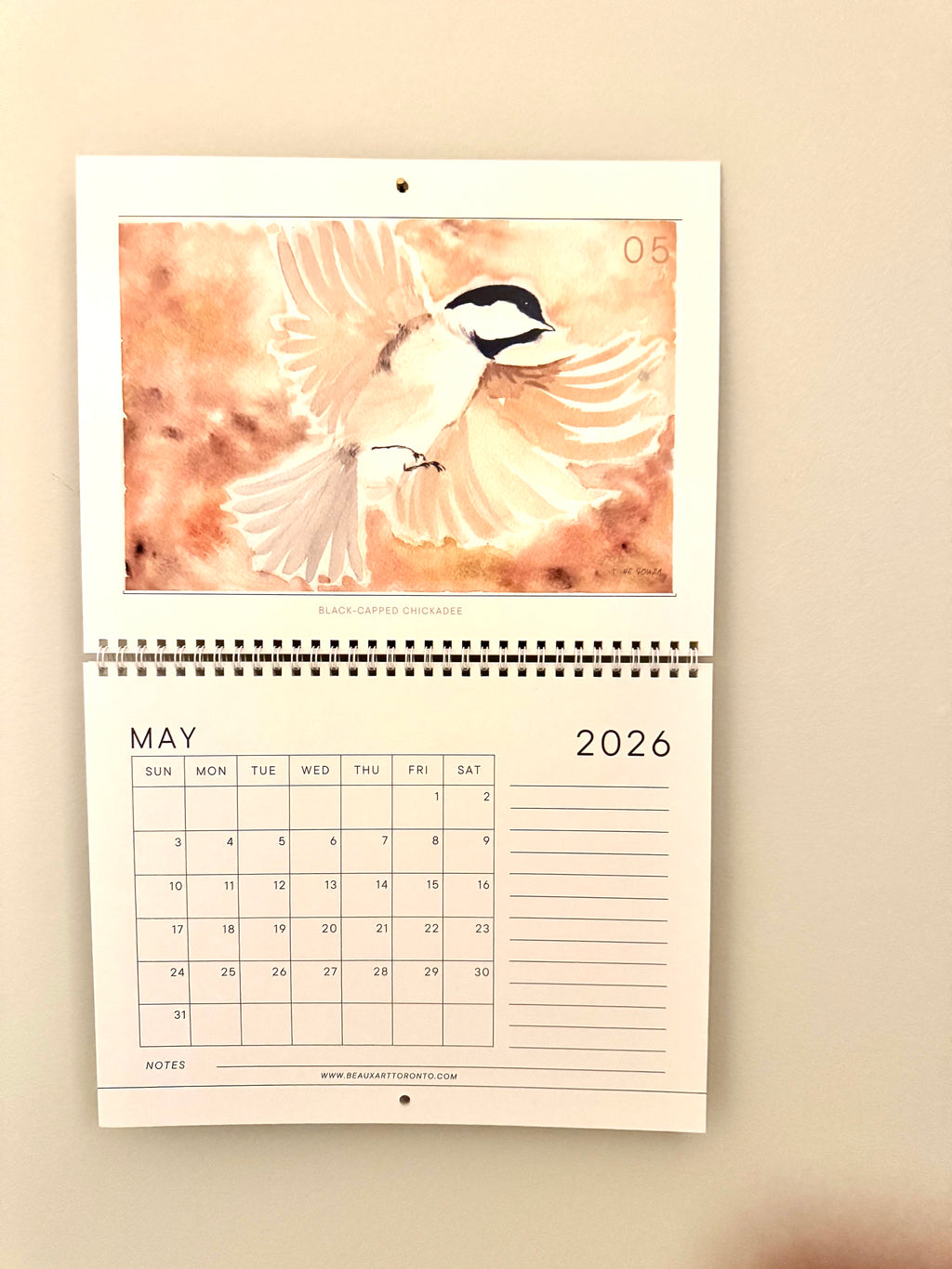 Calendar for May 2026 with a bird design on a beige background