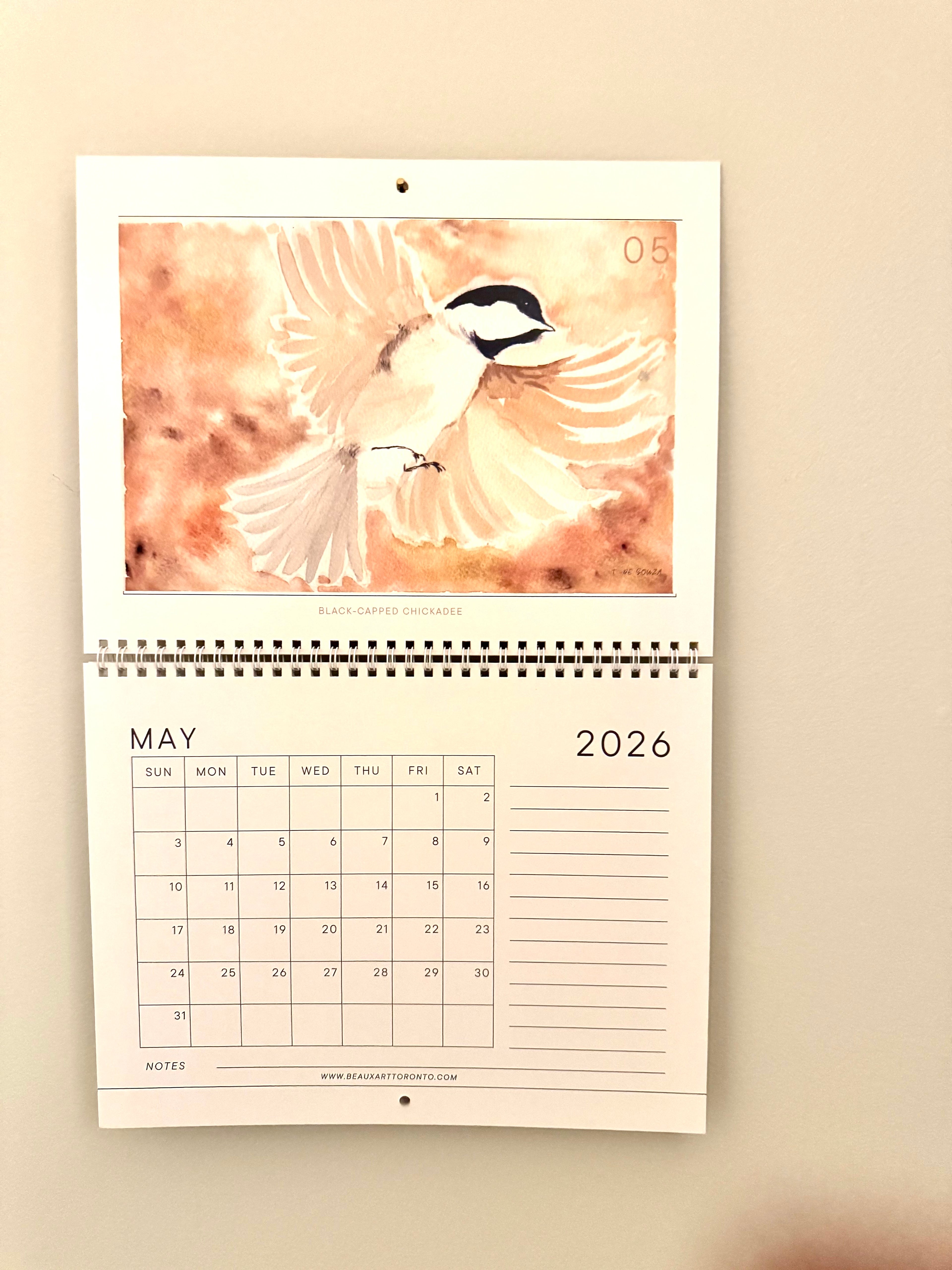 Calendar for May 2026 with a bird design on a beige background